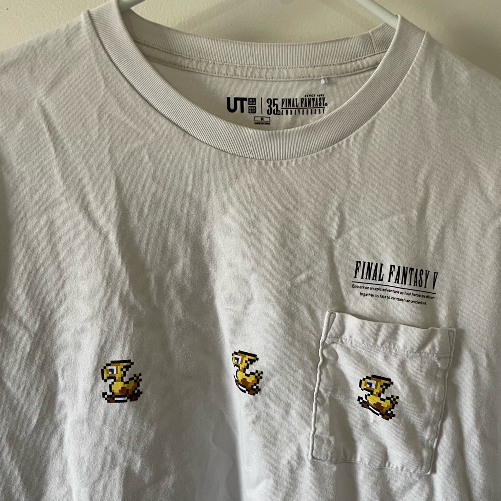Uniqlo White Men’s Pocket Tee with Yellow Chocobo Icons - Picture 2 of 4